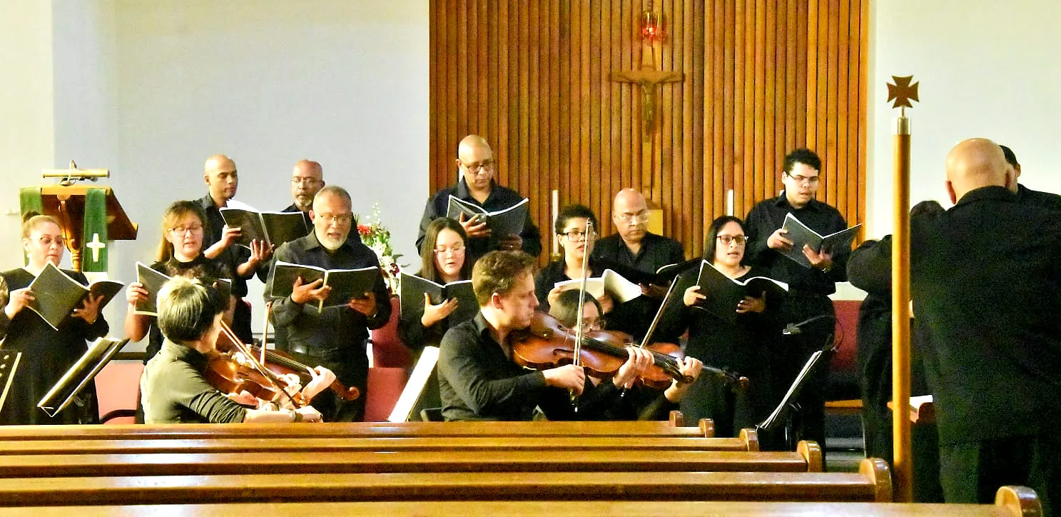 Choir performing with instrumental ensemble