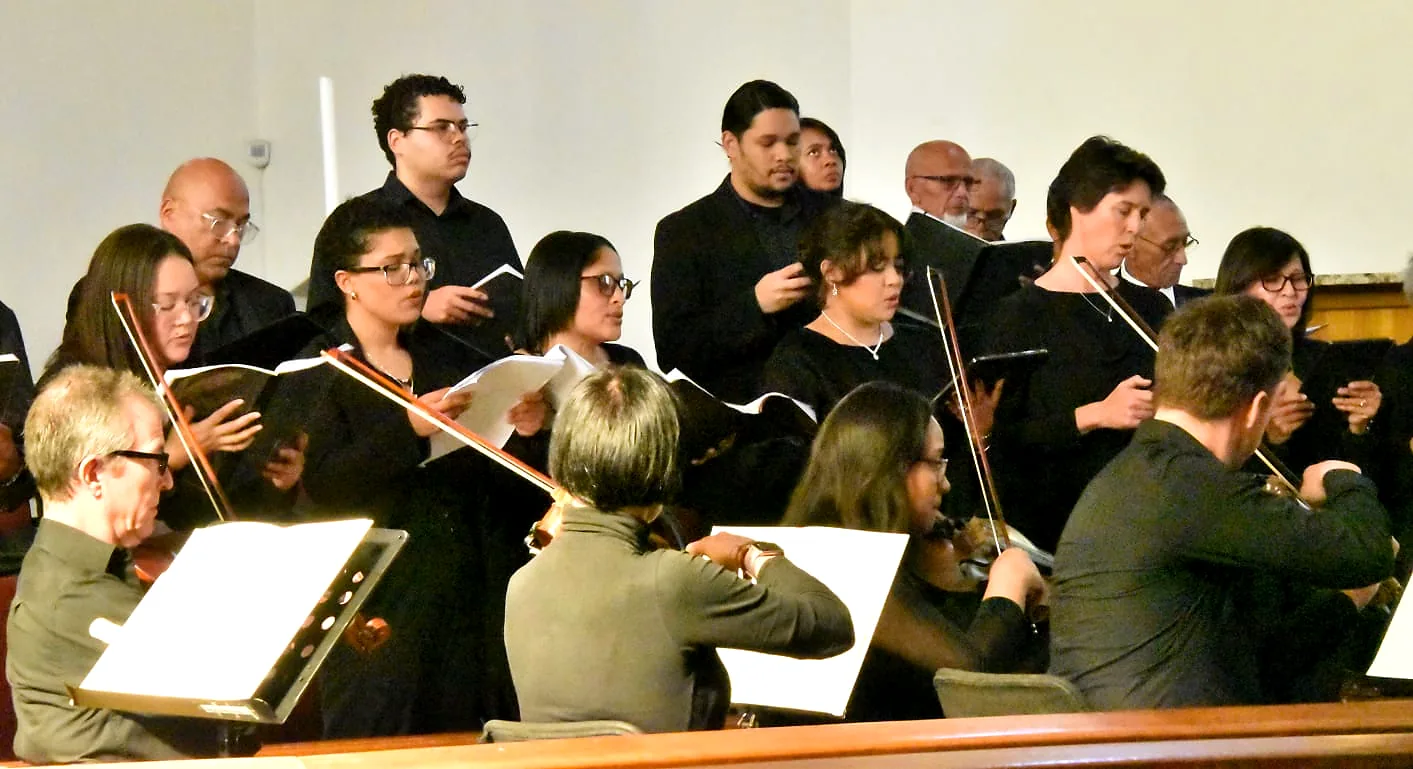 Choral singers performing with string players