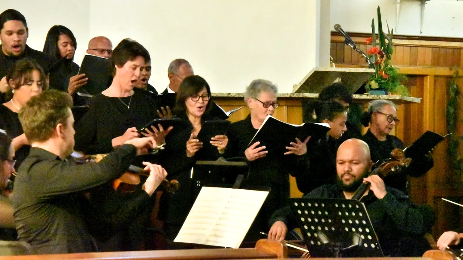 Choral singers performing during the concert